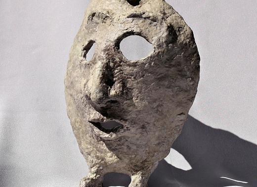Paper mache mask with feet