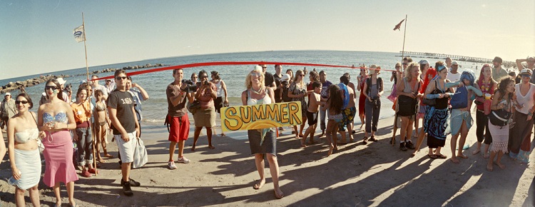 Woman holding ‘Summer’ banner, 2007