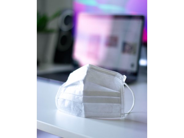 disposable face mask on desk